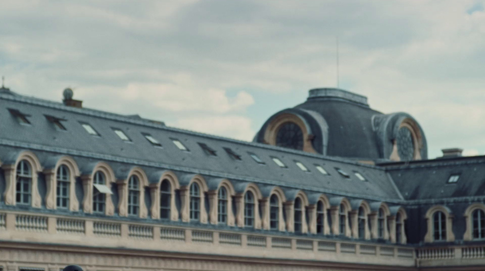 a large building with a clock on the front of it