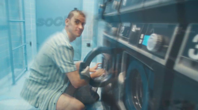 a man is working on a washing machine