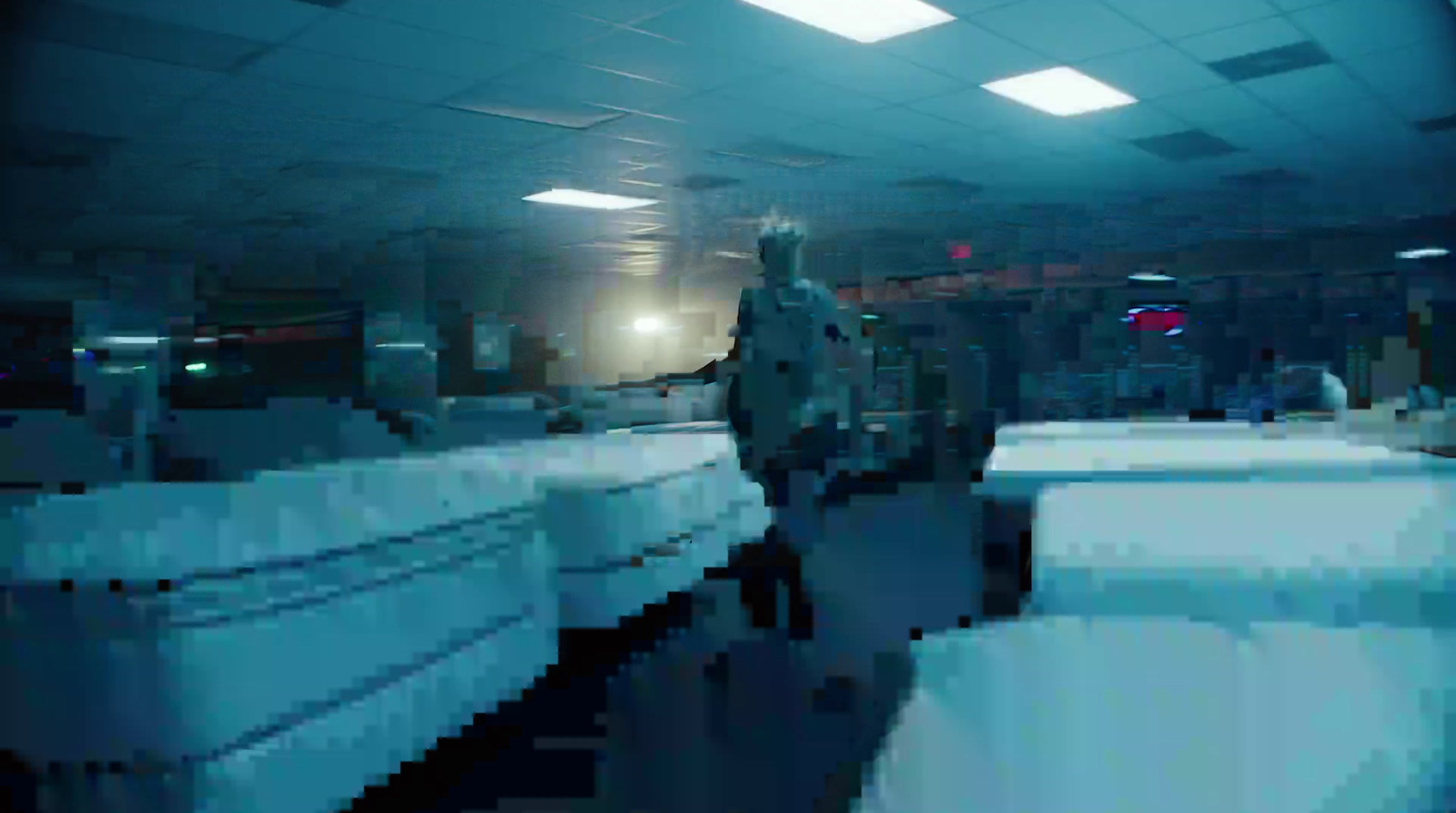 a blurry photo of a man standing in a room