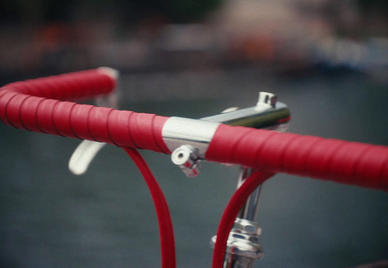 a close up of a red bike handlebar