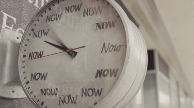 a close up of a clock on a building