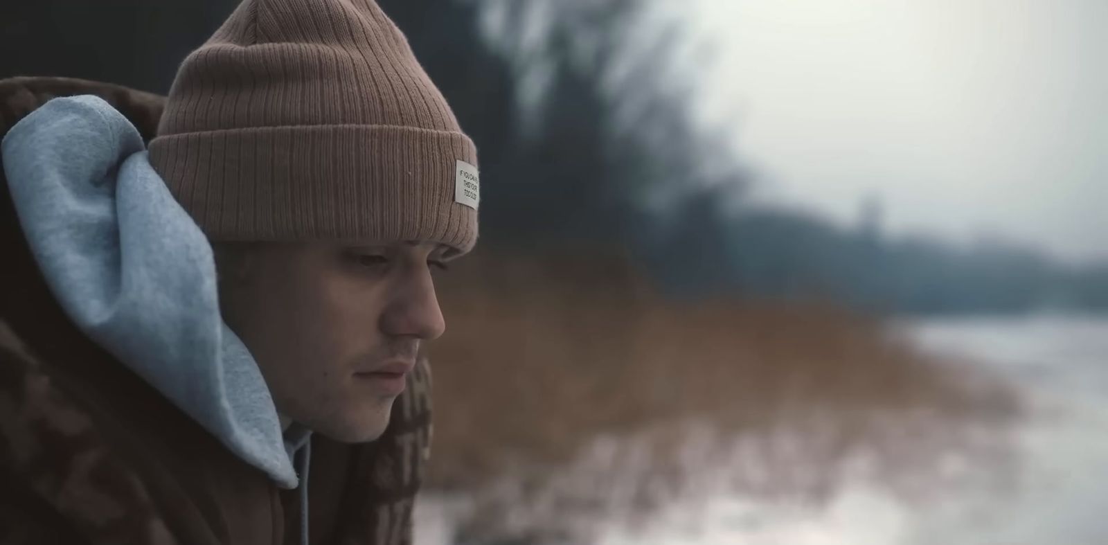 a man wearing a beanie and ear muffs