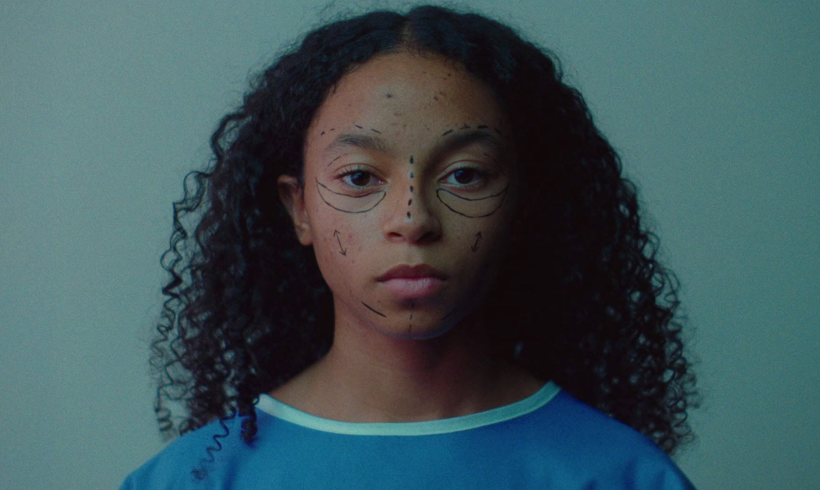 a young girl with freckles on her face