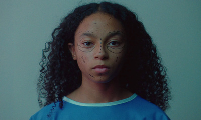 a young girl with freckles on her face