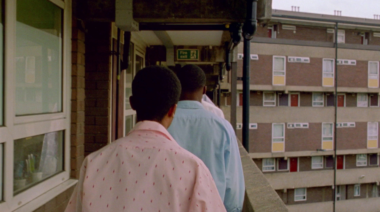 a group of people standing outside of a building