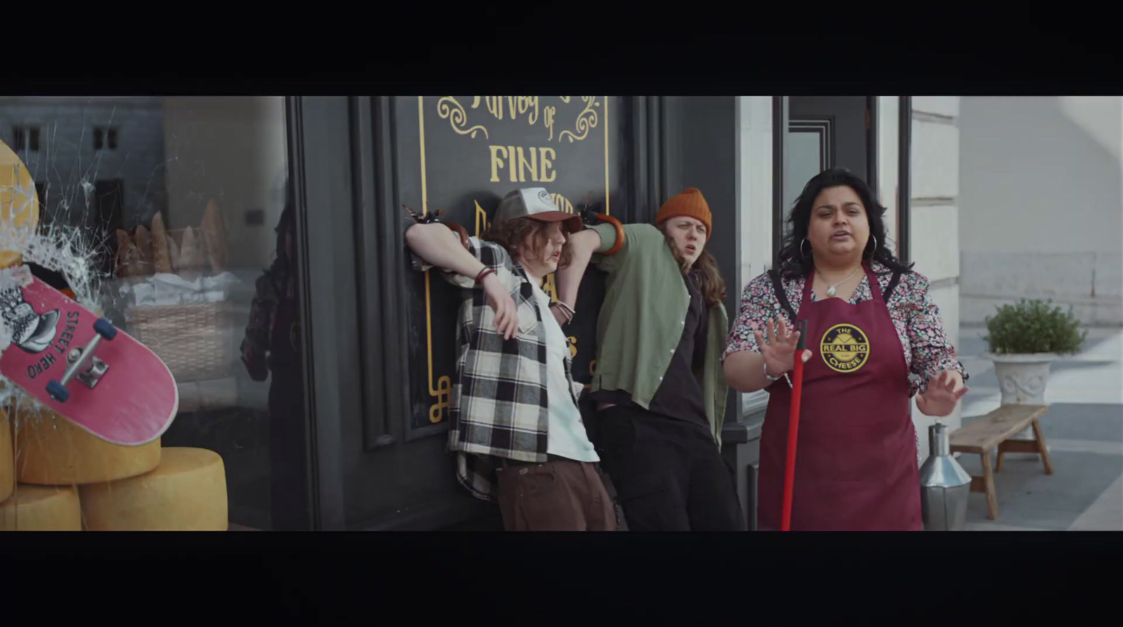 a group of people standing in front of a store