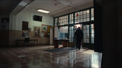 a man standing in a doorway of a building