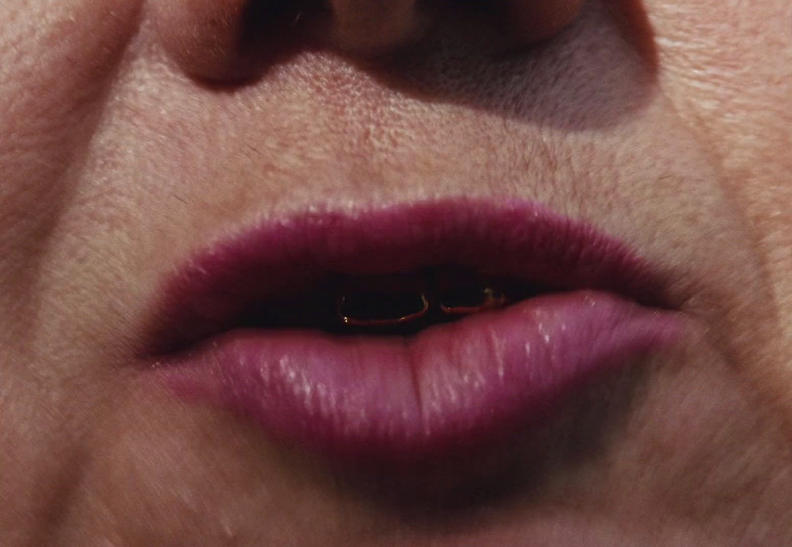 a close up of a woman's lips and nose