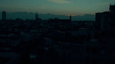 a view of a city at night from a rooftop