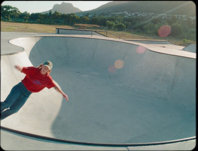 a man riding a skateboard up the side of a ramp