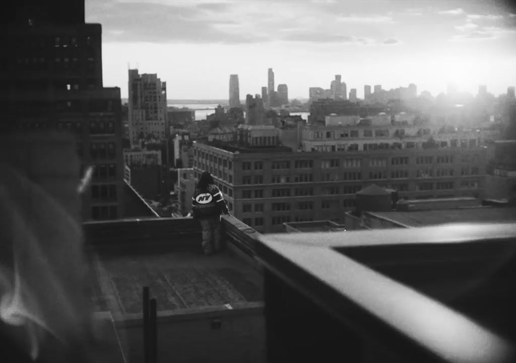 a man standing on top of a tall building