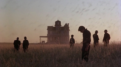 a group of men standing in a field