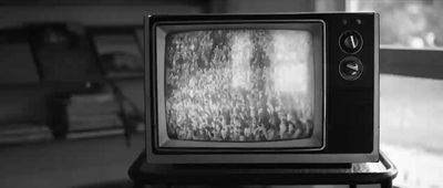 a black and white photo of an old tv