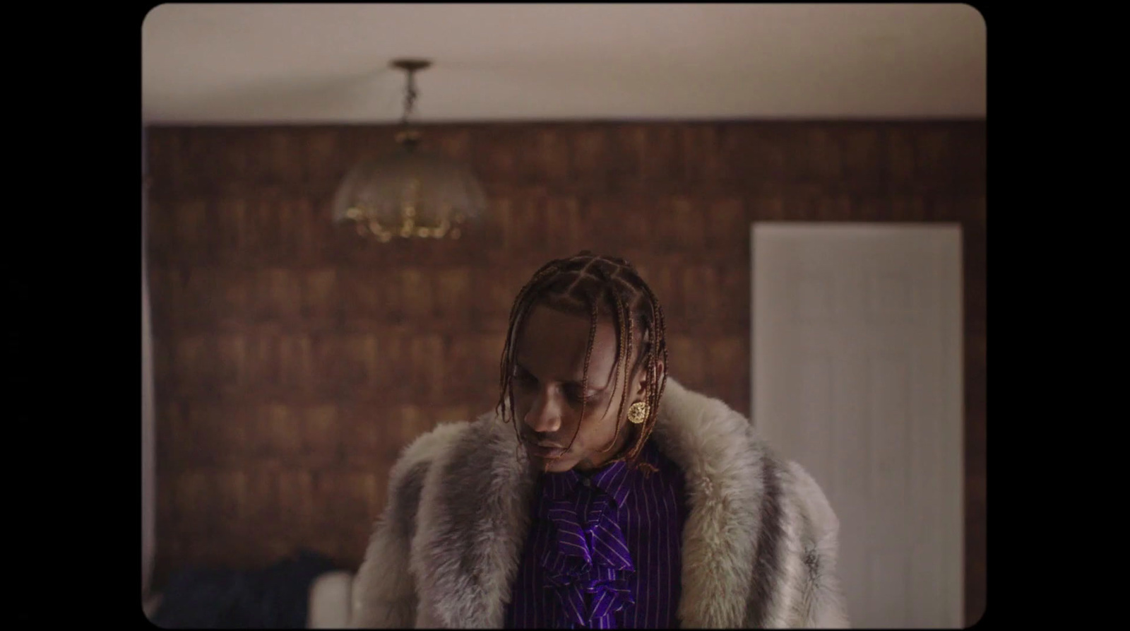 a woman with dreadlocks standing in a room