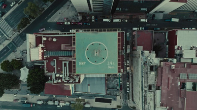 an aerial view of a building with a basketball court