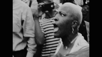 a black and white photo of a man with his mouth open