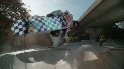 a man riding a skateboard up the side of a ramp