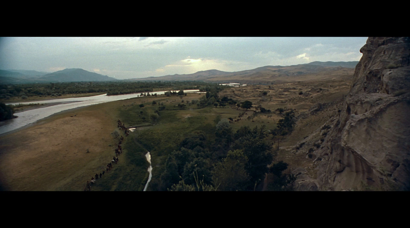 an aerial view of a river running through a valley