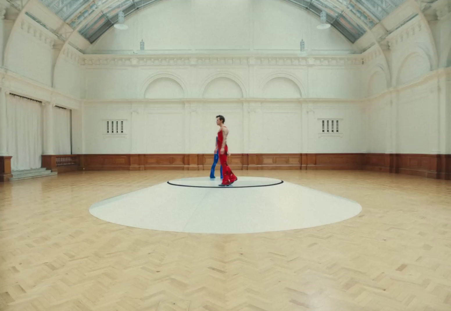 a person standing on a circle in a room