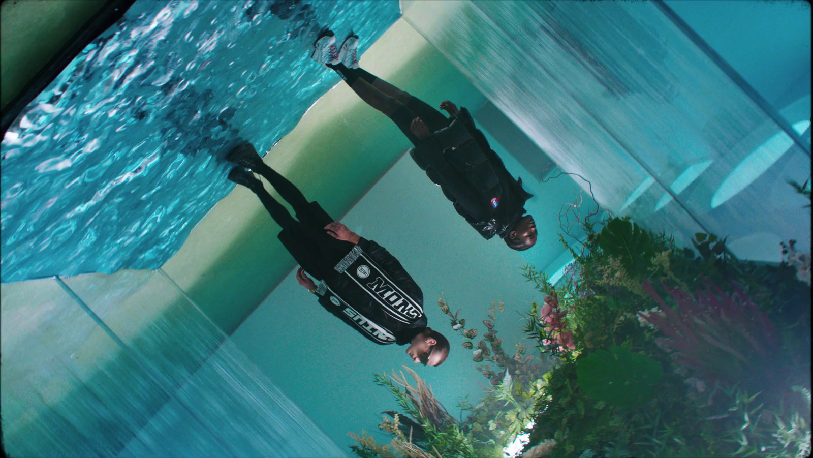 a man standing in front of a swimming pool