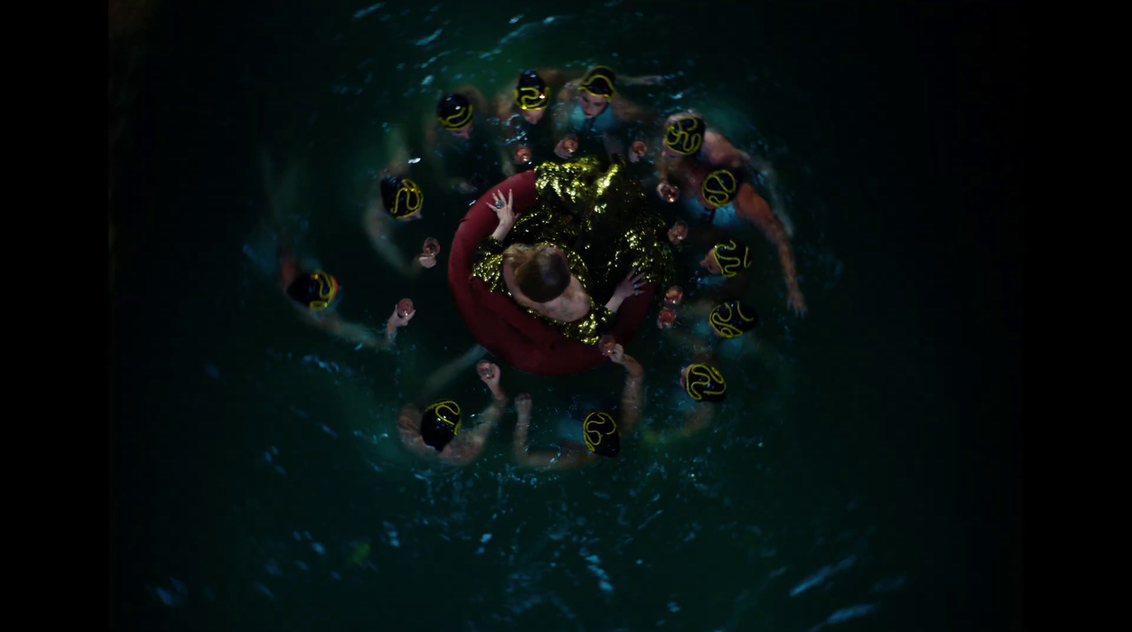 a group of people swimming in the water