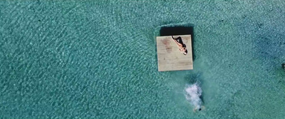 an aerial view of a boat in the water