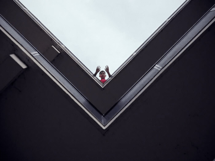 a person standing on top of a tall building