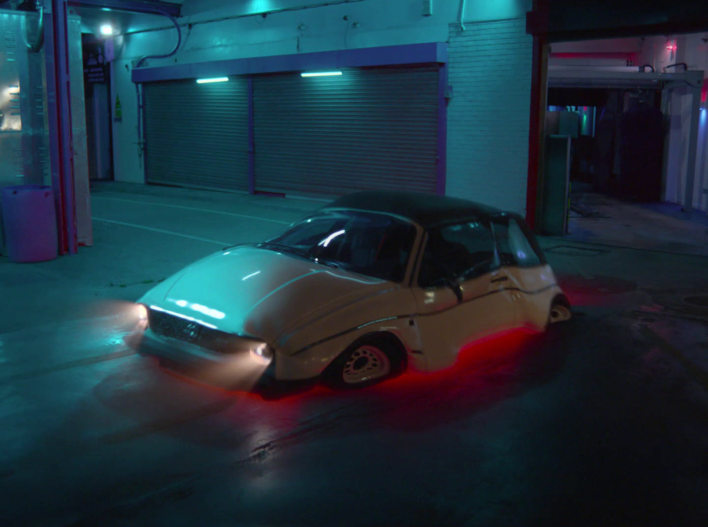 a car is parked in a parking lot at night