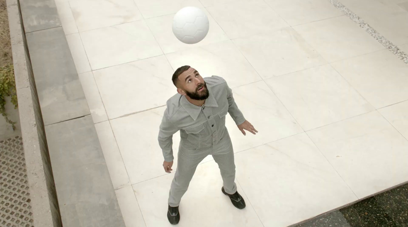 a man is throwing a ball in the air