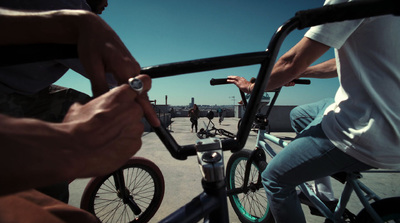 a group of people riding bikes down a street