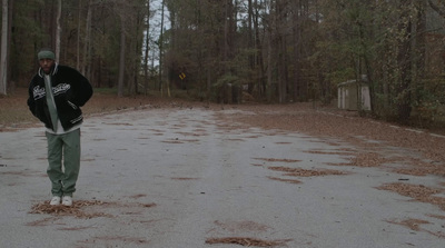 a man standing in the middle of a road