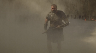 a man in a costume standing in the fog