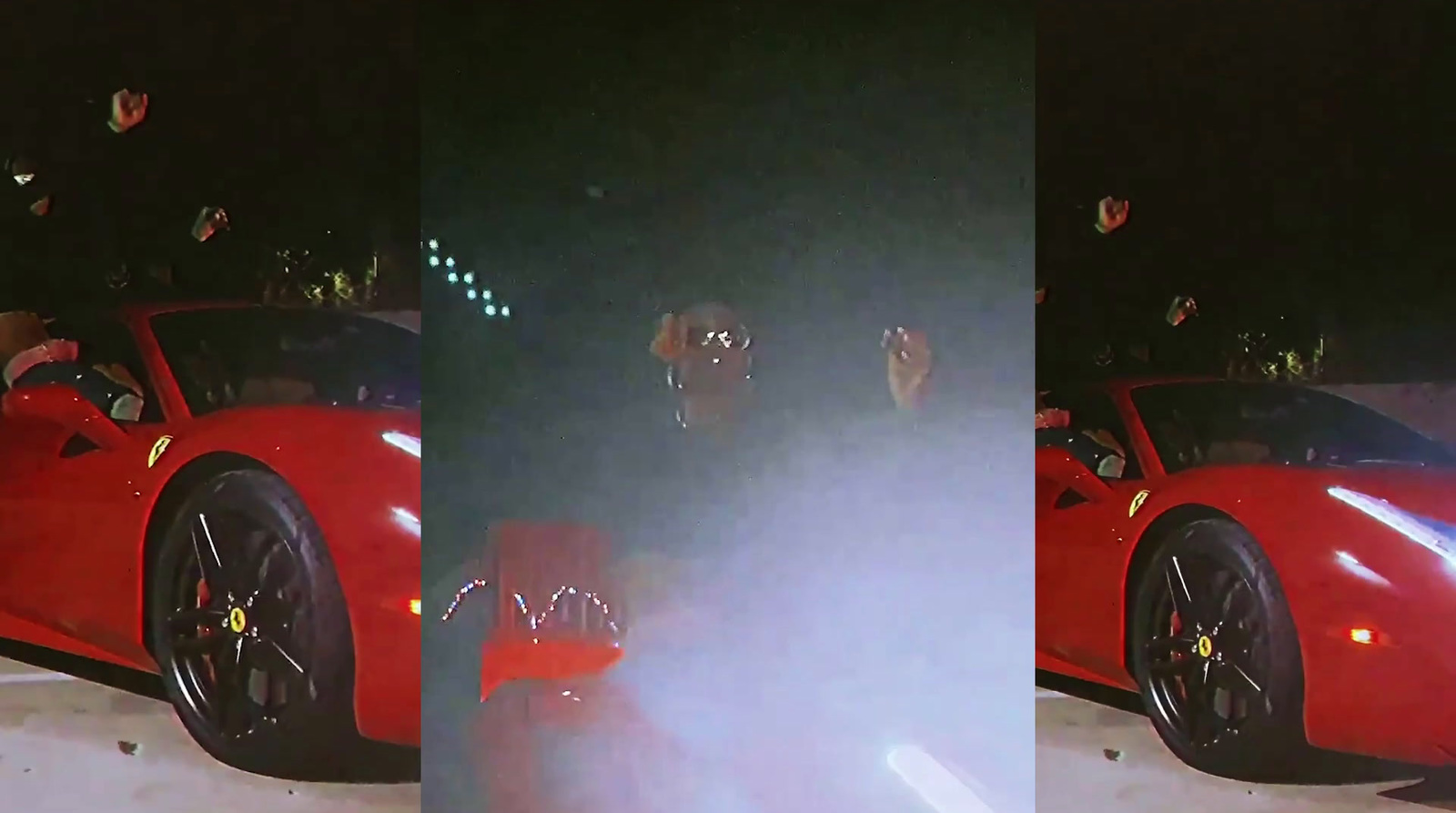 a red sports car parked in a parking lot at night