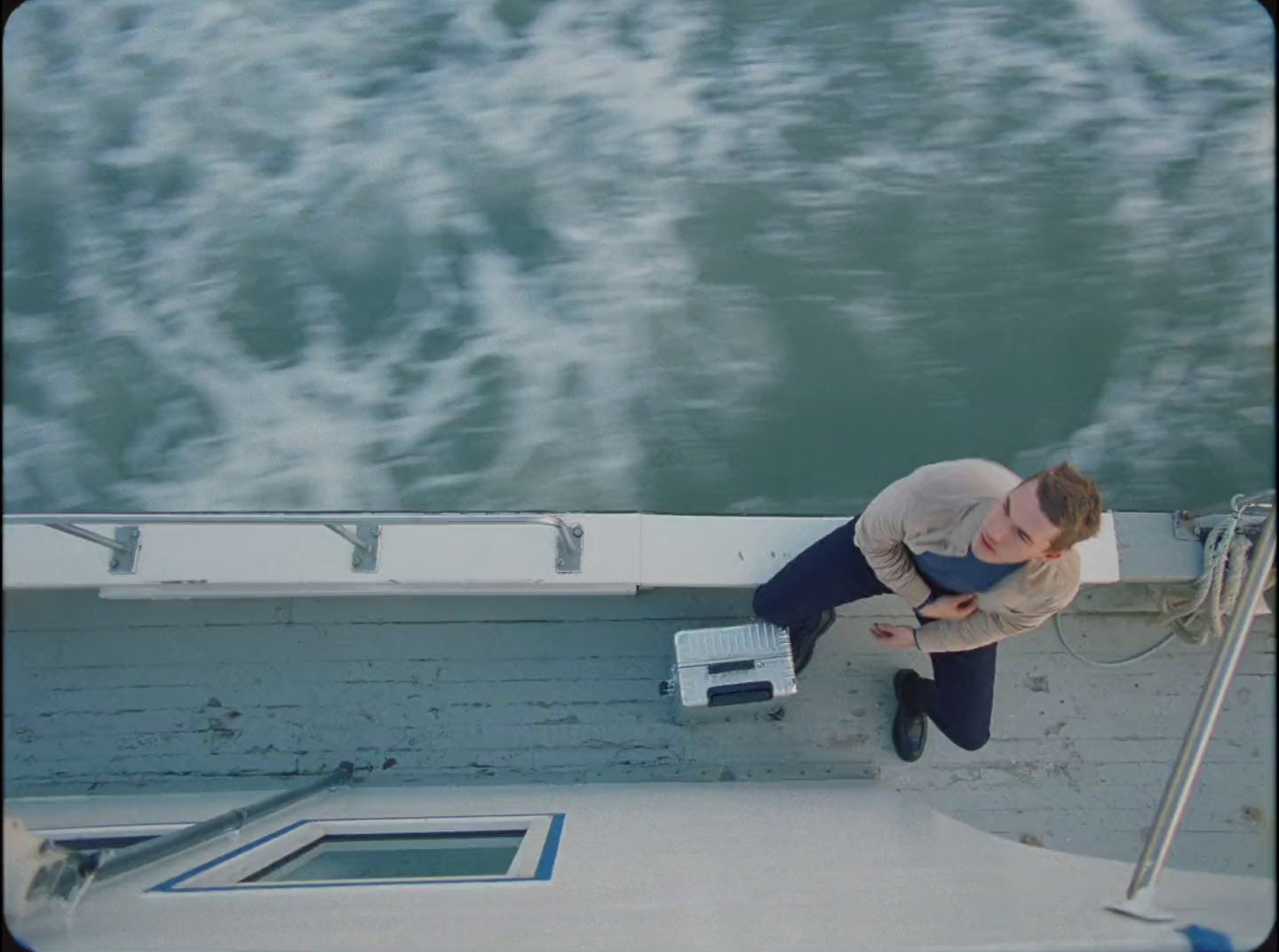 a man standing on a boat in the water