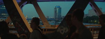 a group of people standing on top of a bridge