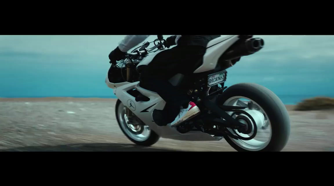 a person riding a motorcycle on a dirt road