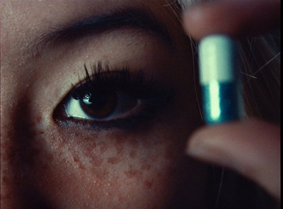 a close up of a woman's eye with a contact lens