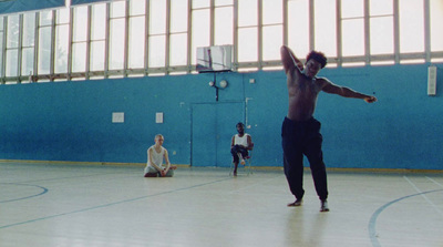 a man standing on top of a basketball court holding a basketball