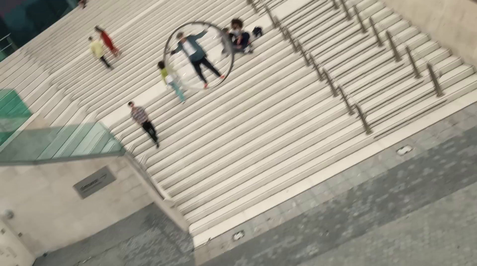 a group of people walking up a flight of stairs