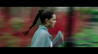 a blurry photo of a woman with a ponytail