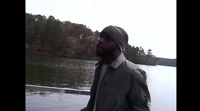 a man standing on a boat in the water