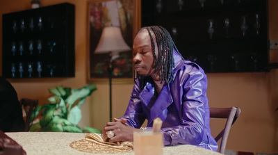 a man sitting at a table in front of a woman