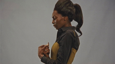 a woman with a ponytail holding a cell phone