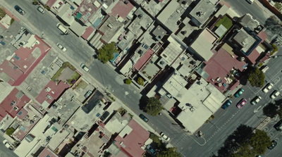 an aerial view of a city street and buildings