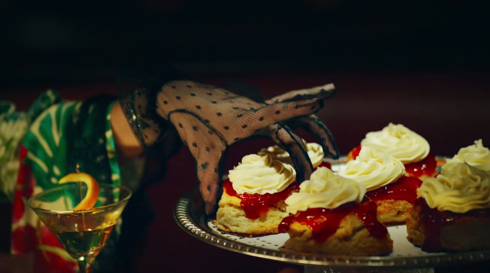 a person is holding a plate with a dessert on it