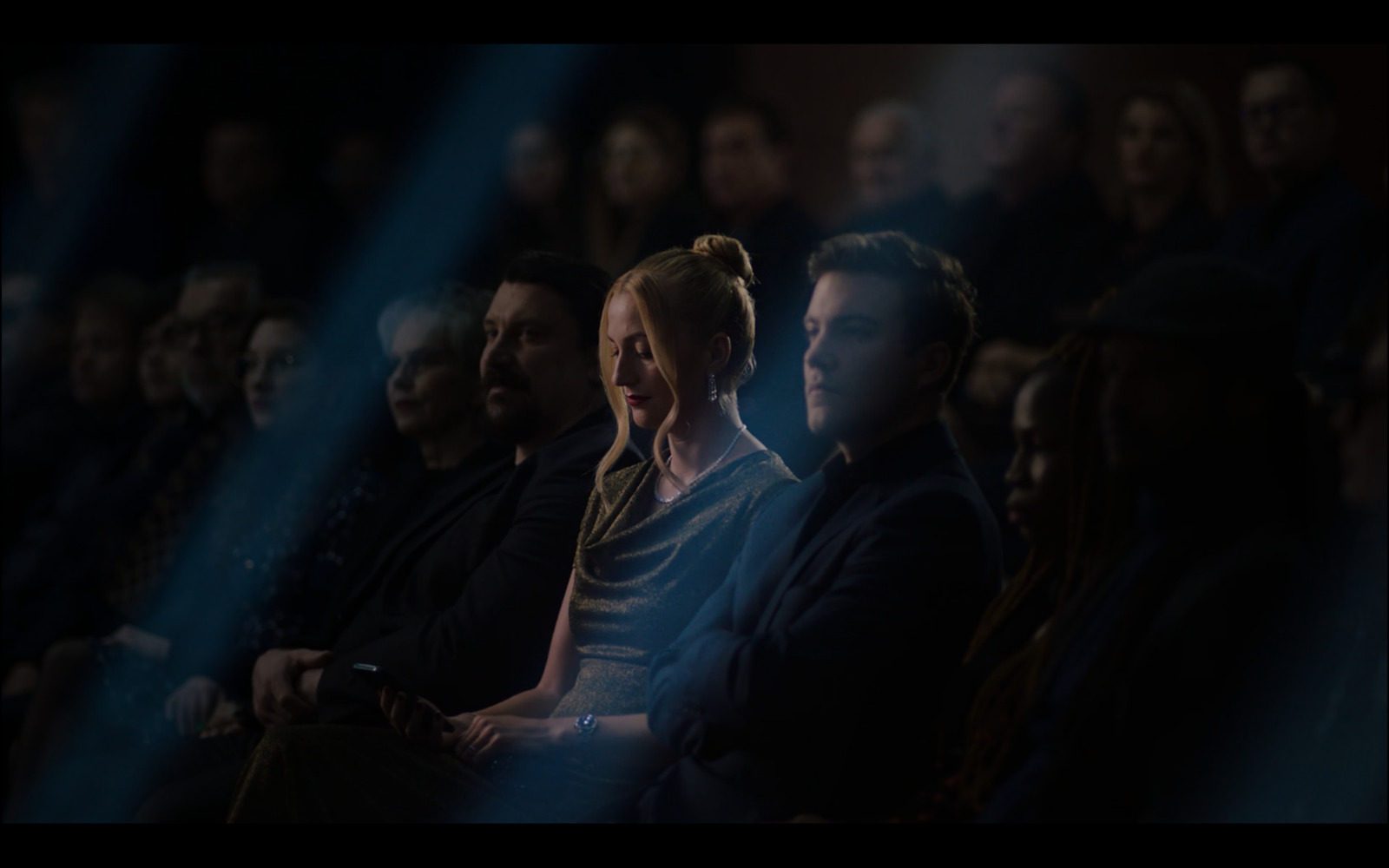 a group of people sitting next to each other