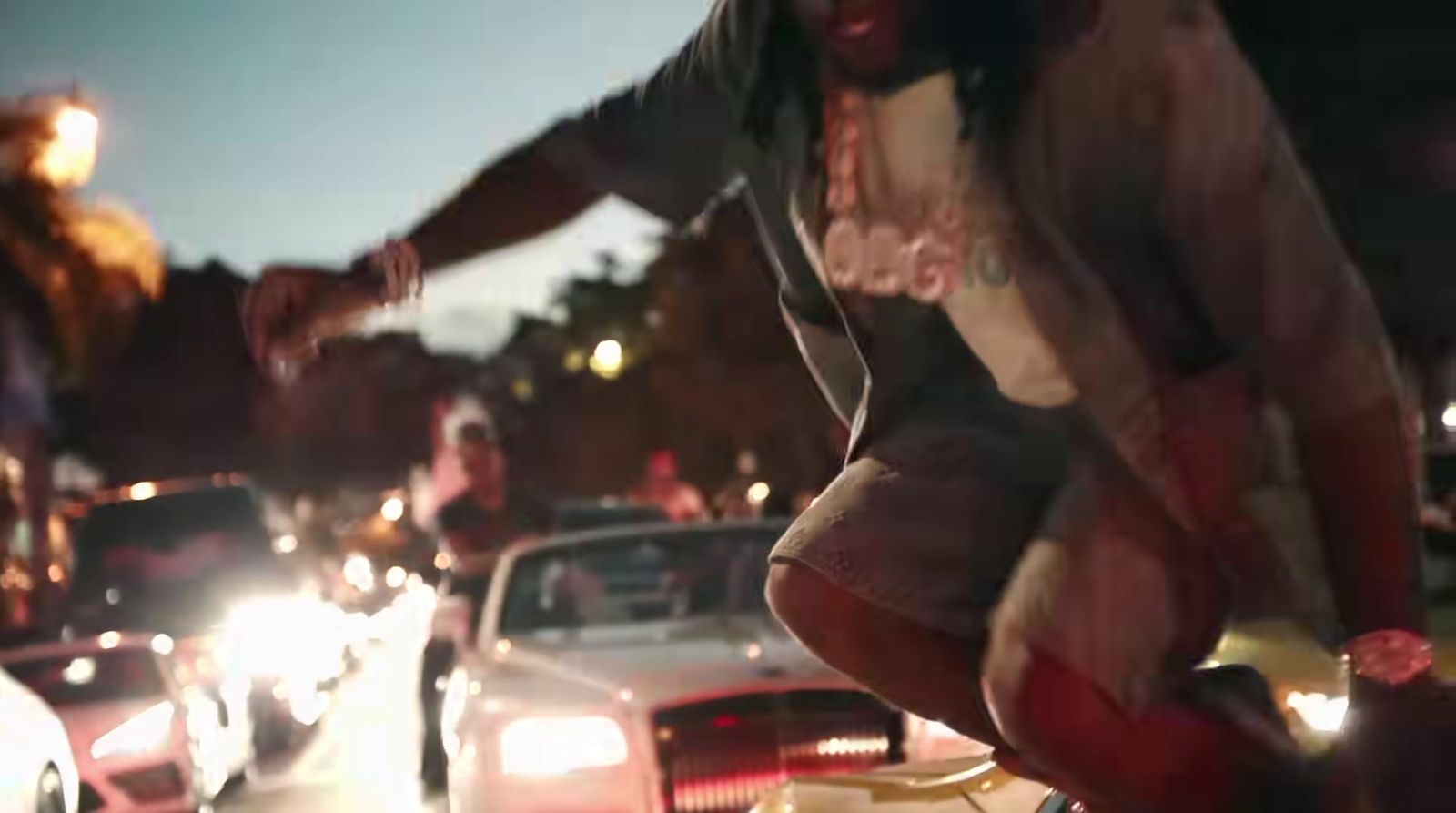 a man riding a skateboard down a busy street