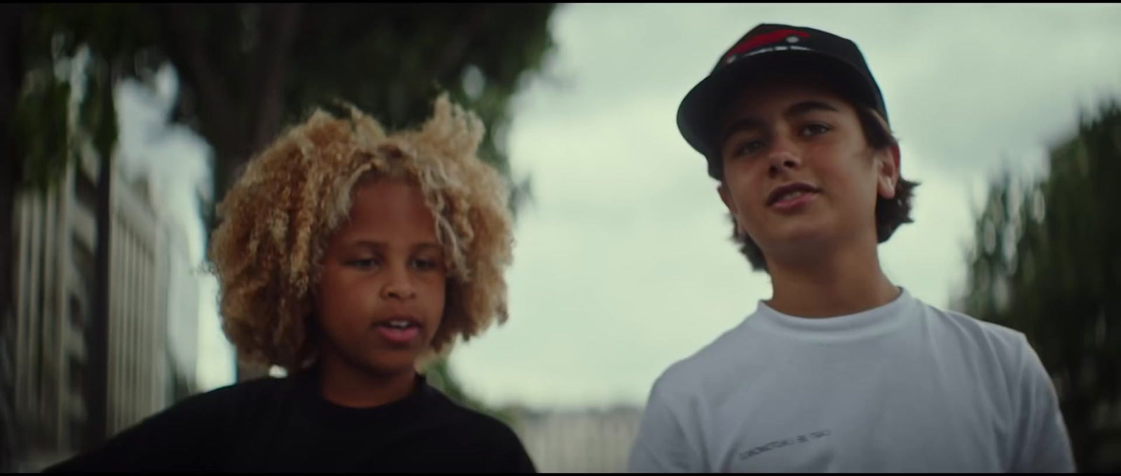 a boy and a girl standing next to each other