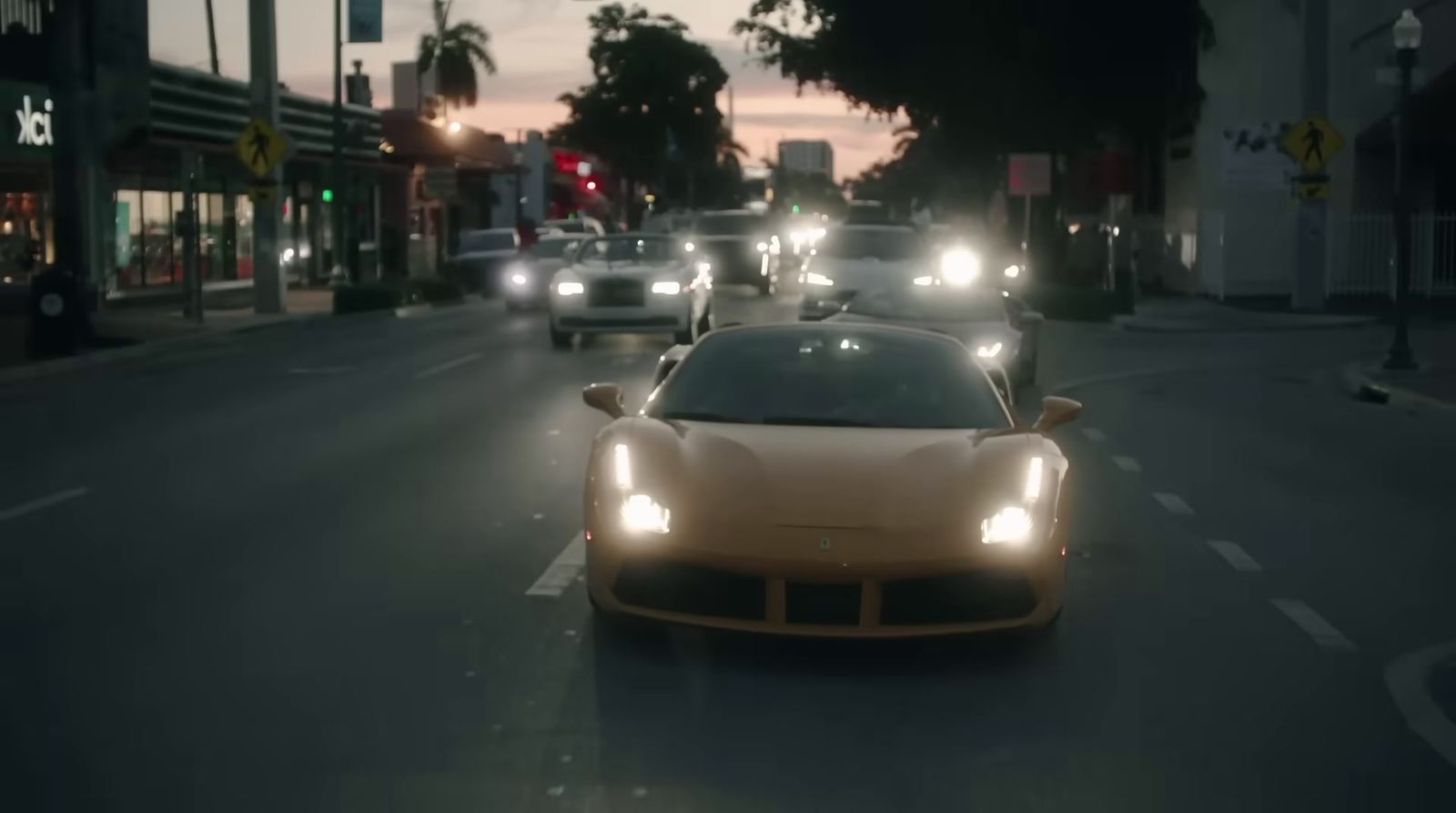 a car driving down a city street at night