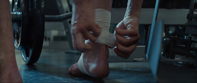 a pair of feet with bandages on them